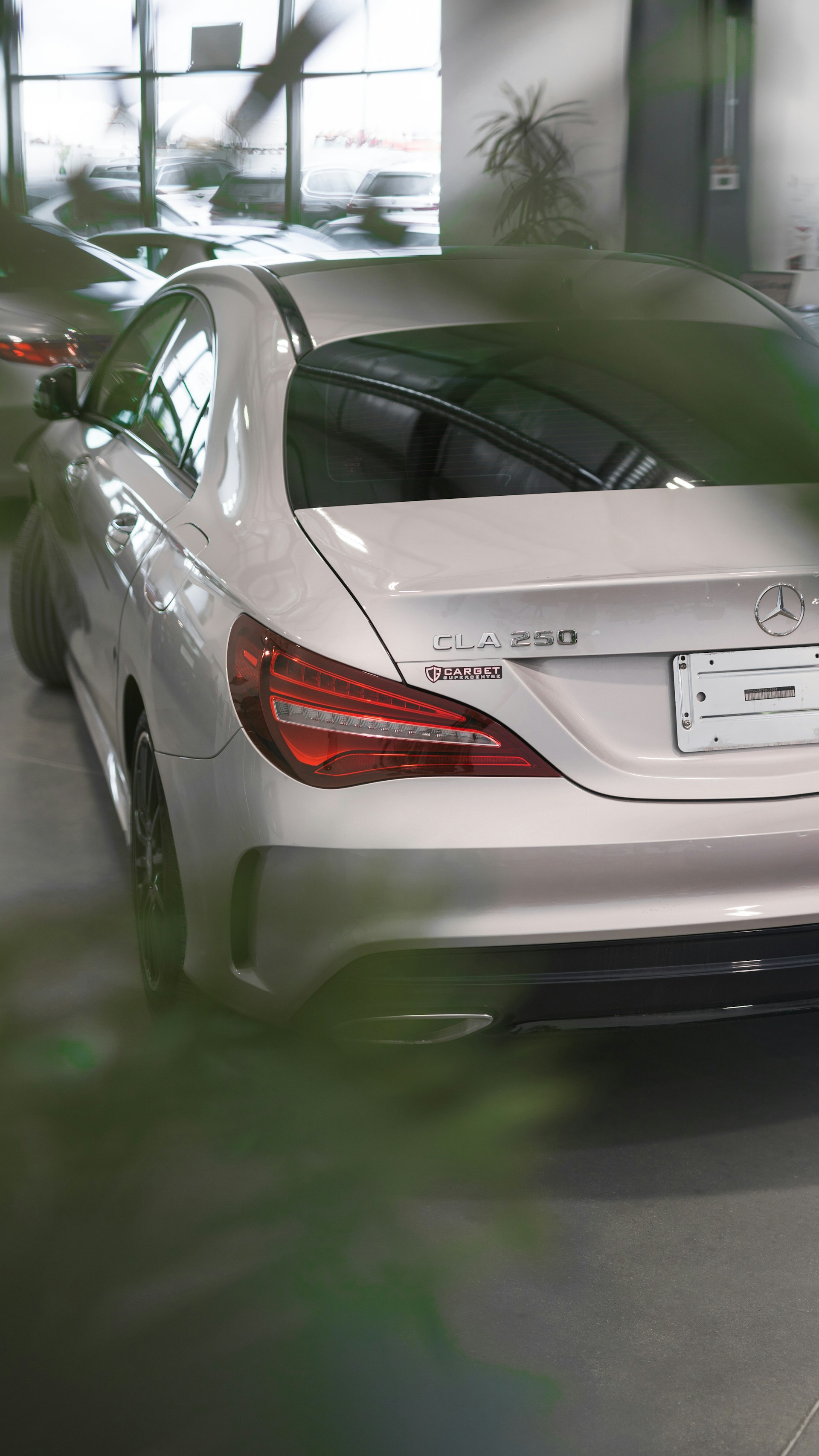 a white car is parked in a garage