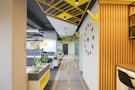a long hallway with yellow and black accents