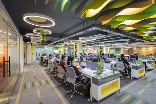 a large open office space with many desks and chairs