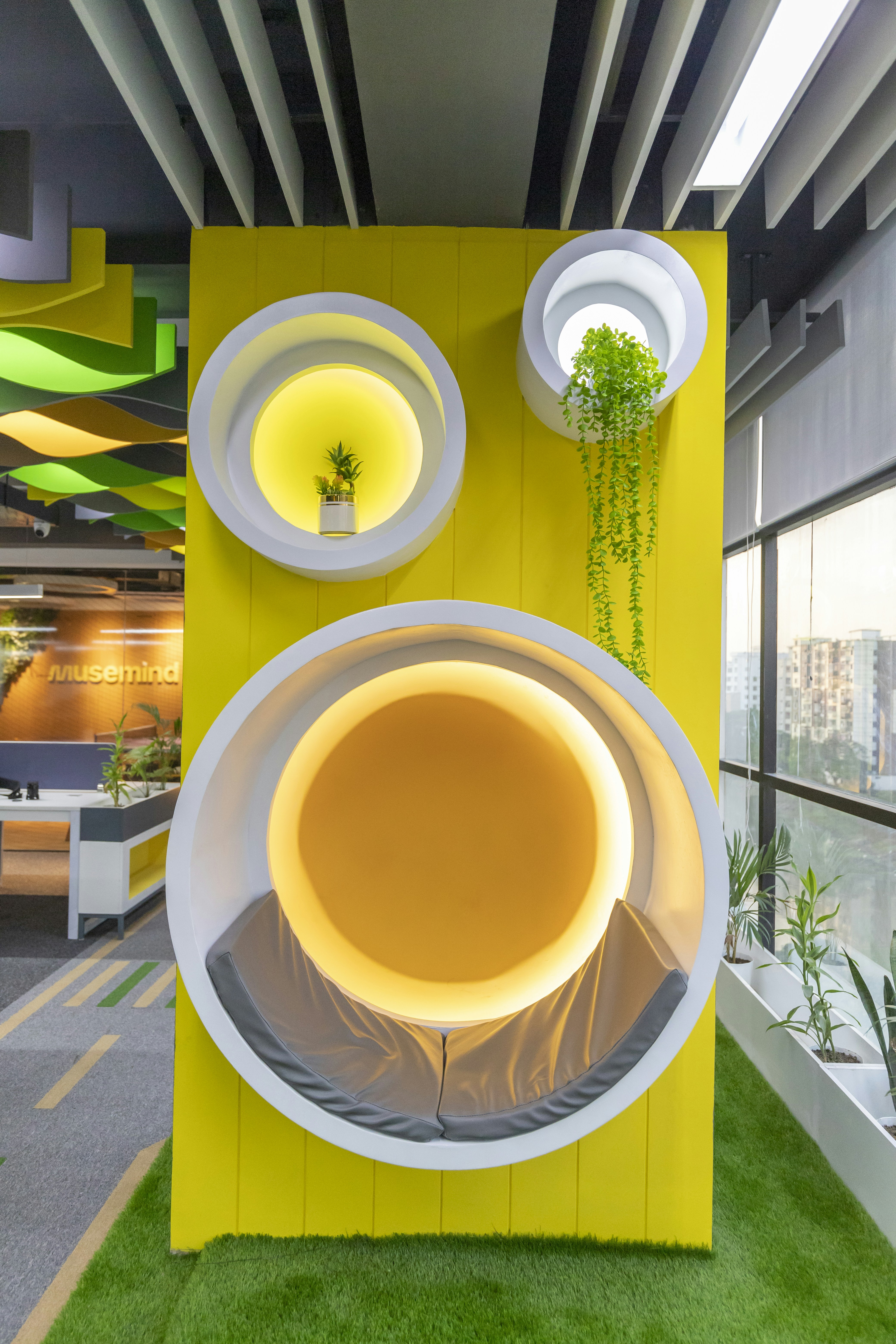 a yellow and white display with plates and plants