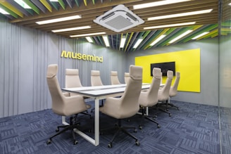 a conference room with a long table and chairs