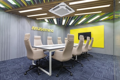 a conference room with a long table and chairs