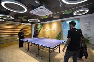 a ping pong table in a large room