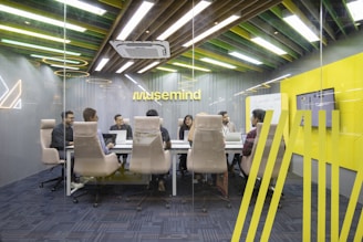 a group of people sitting around a table