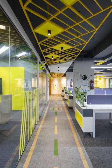 a long hallway with yellow and grey dividers