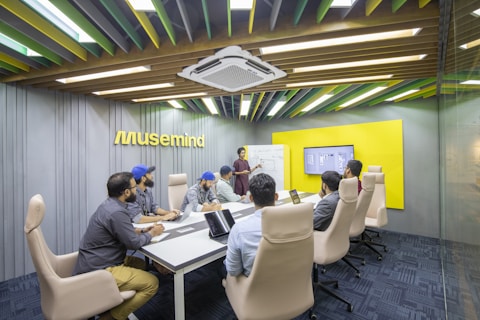 a group of people sitting around a conference table