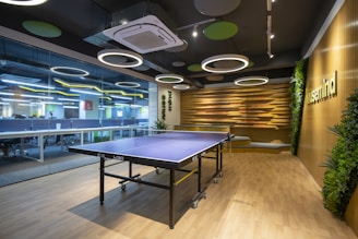 a ping pong table in a large room