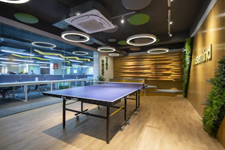 a ping pong table in a large room