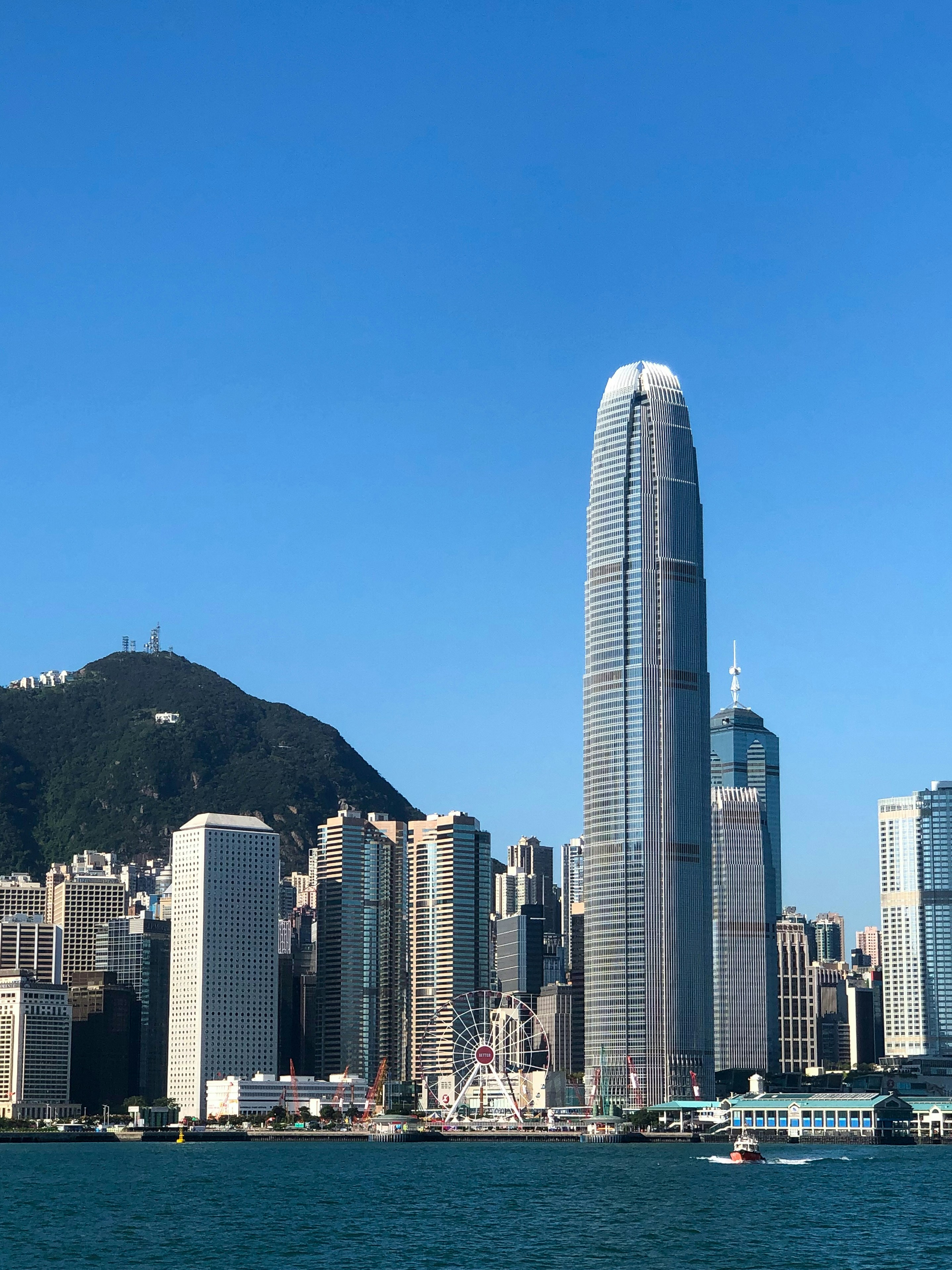 a large body of water with a city in the background