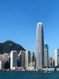 a large body of water with a city in the background