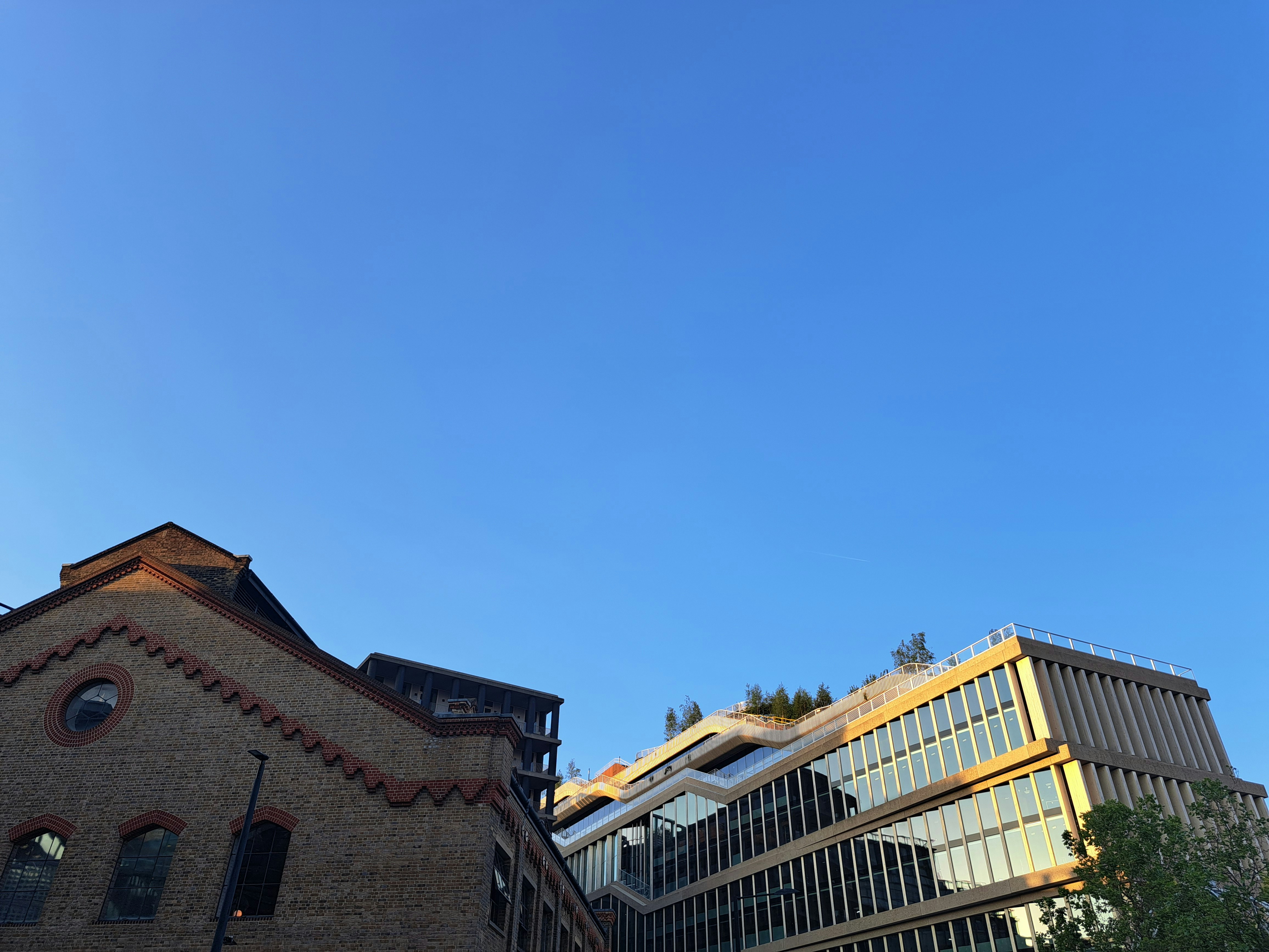 a very tall building sitting next to a tall building