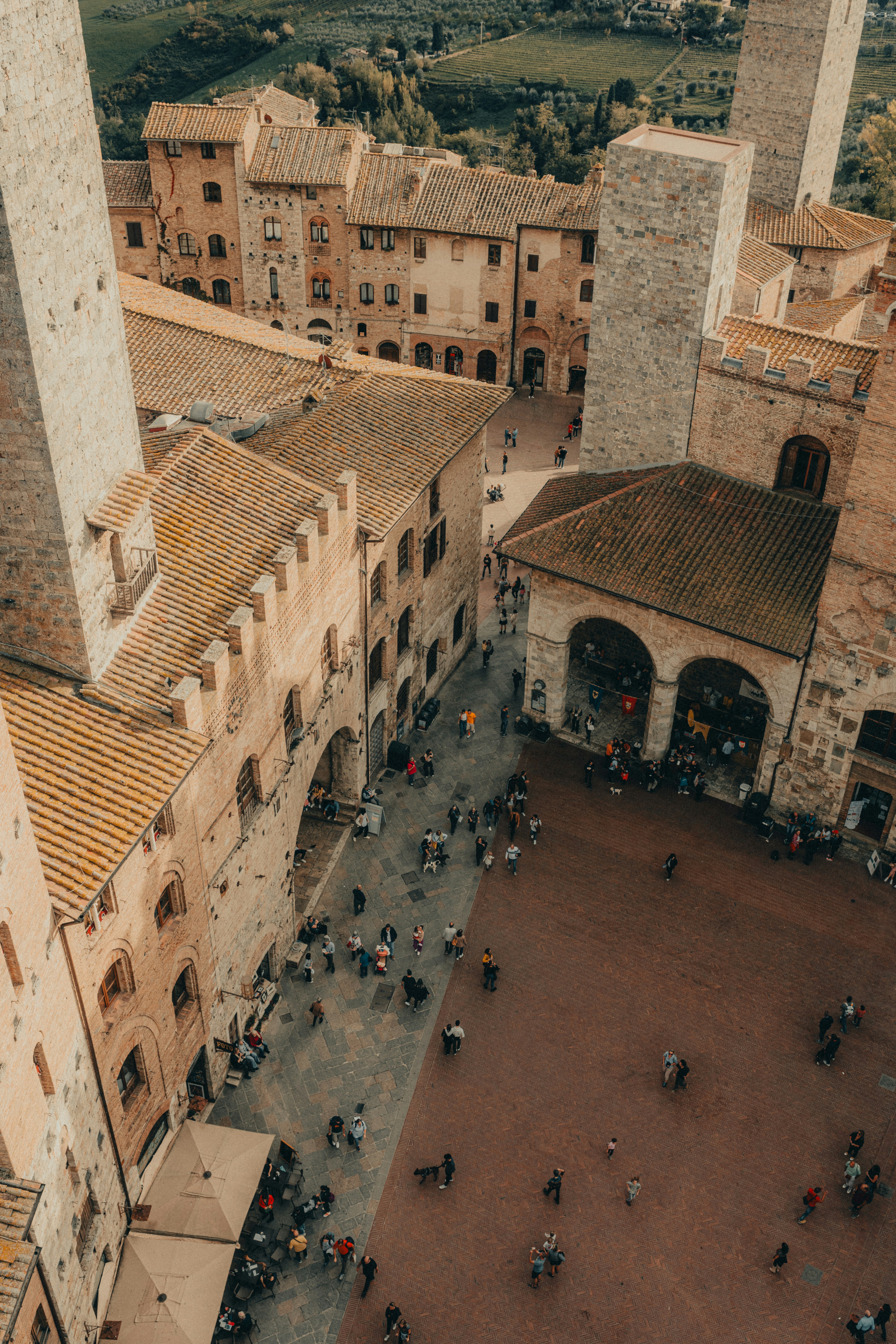 a group of people walking around a courtyard