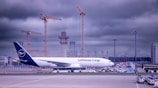 a large jetliner sitting on top of an airport tarmac