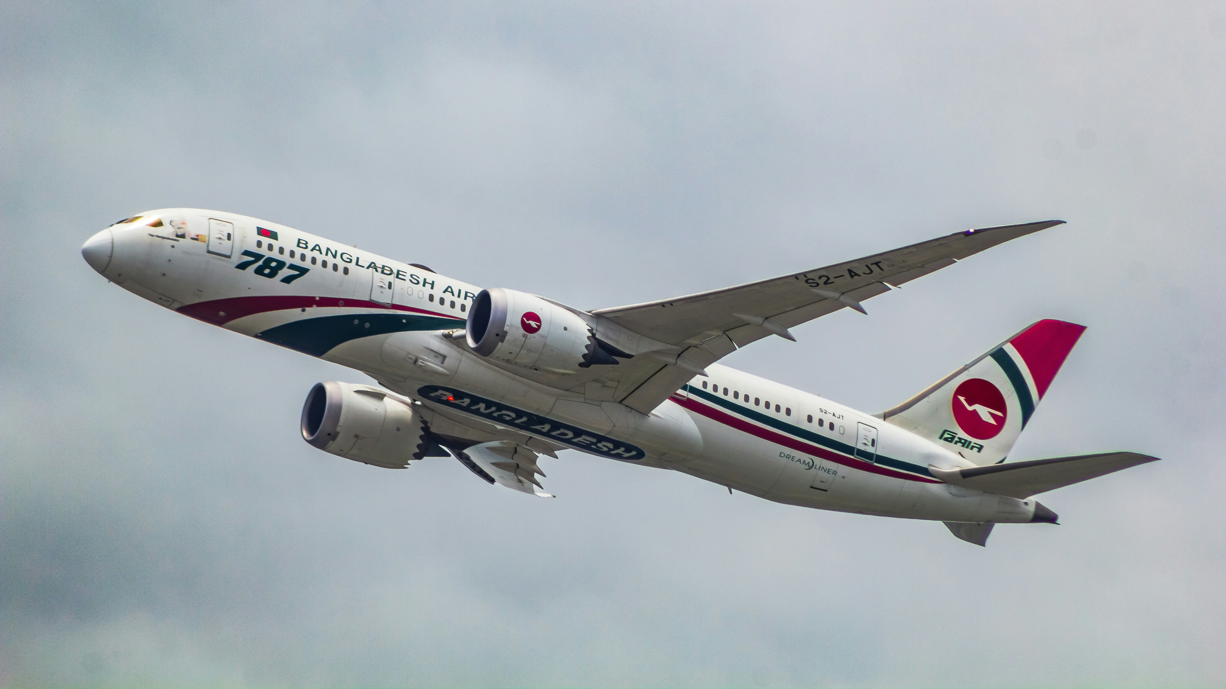 a large jetliner flying through a cloudy sky, Biman Bangladesh Airlines Hangsabalaka S2-AJT Boeing 787-8