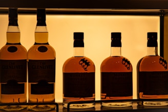 a row of bottles of whiskey sitting on a shelf