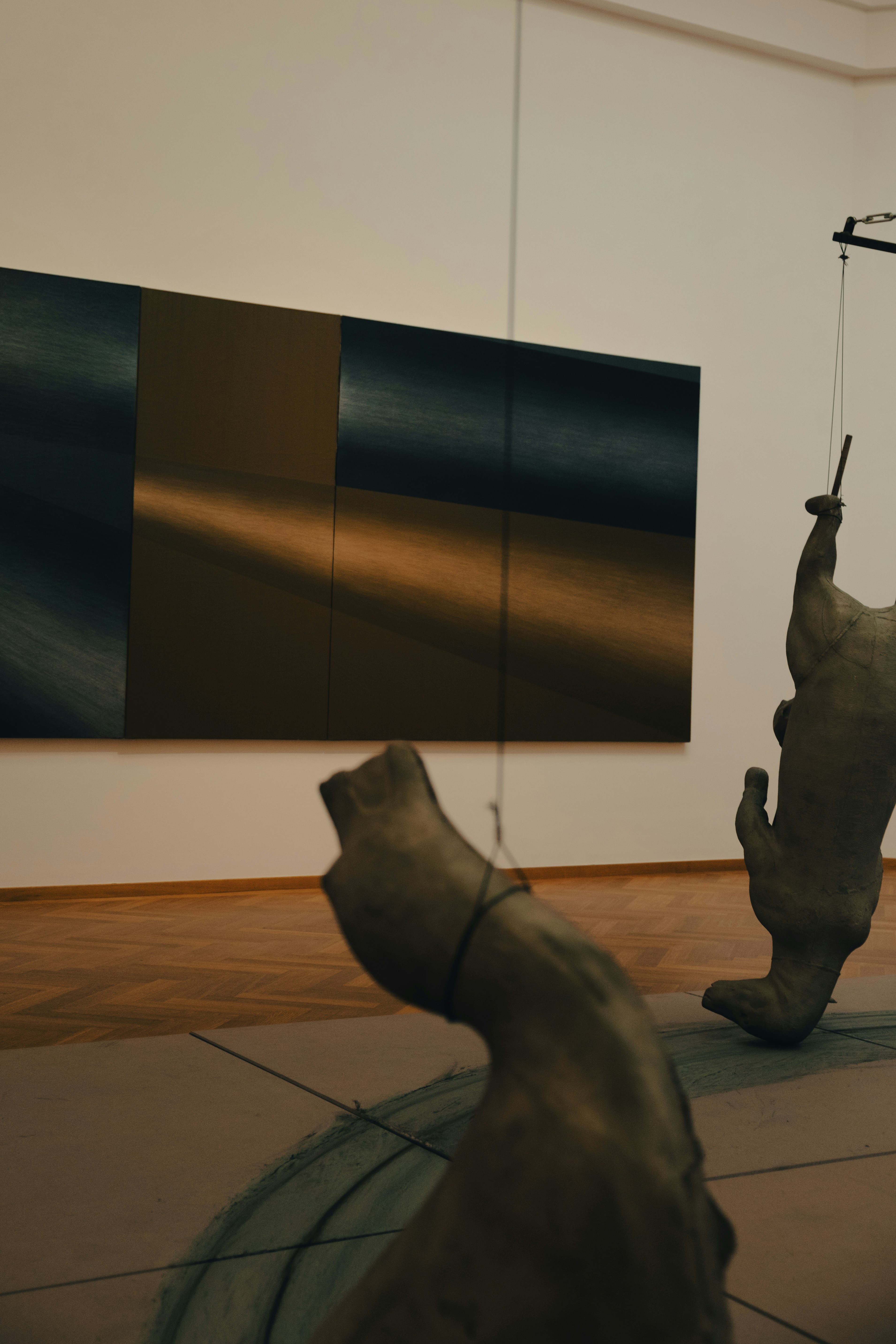 a sculpture of a fish hanging from a hook