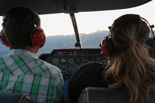 a couple of people that are sitting in a plane