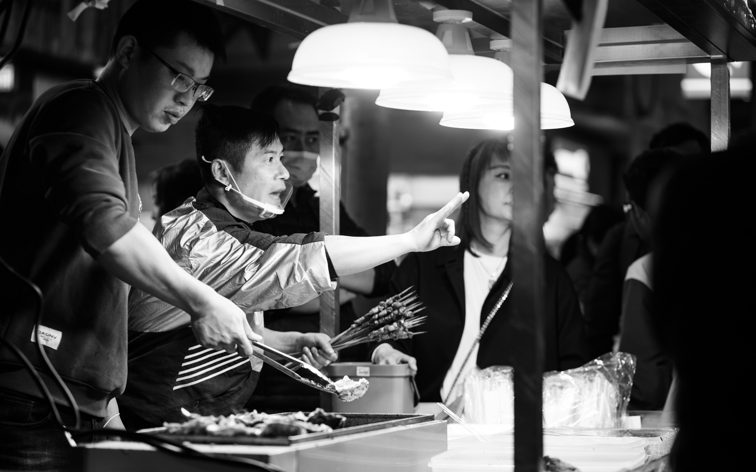 Chef briefing a kitchen team during pre-shift training