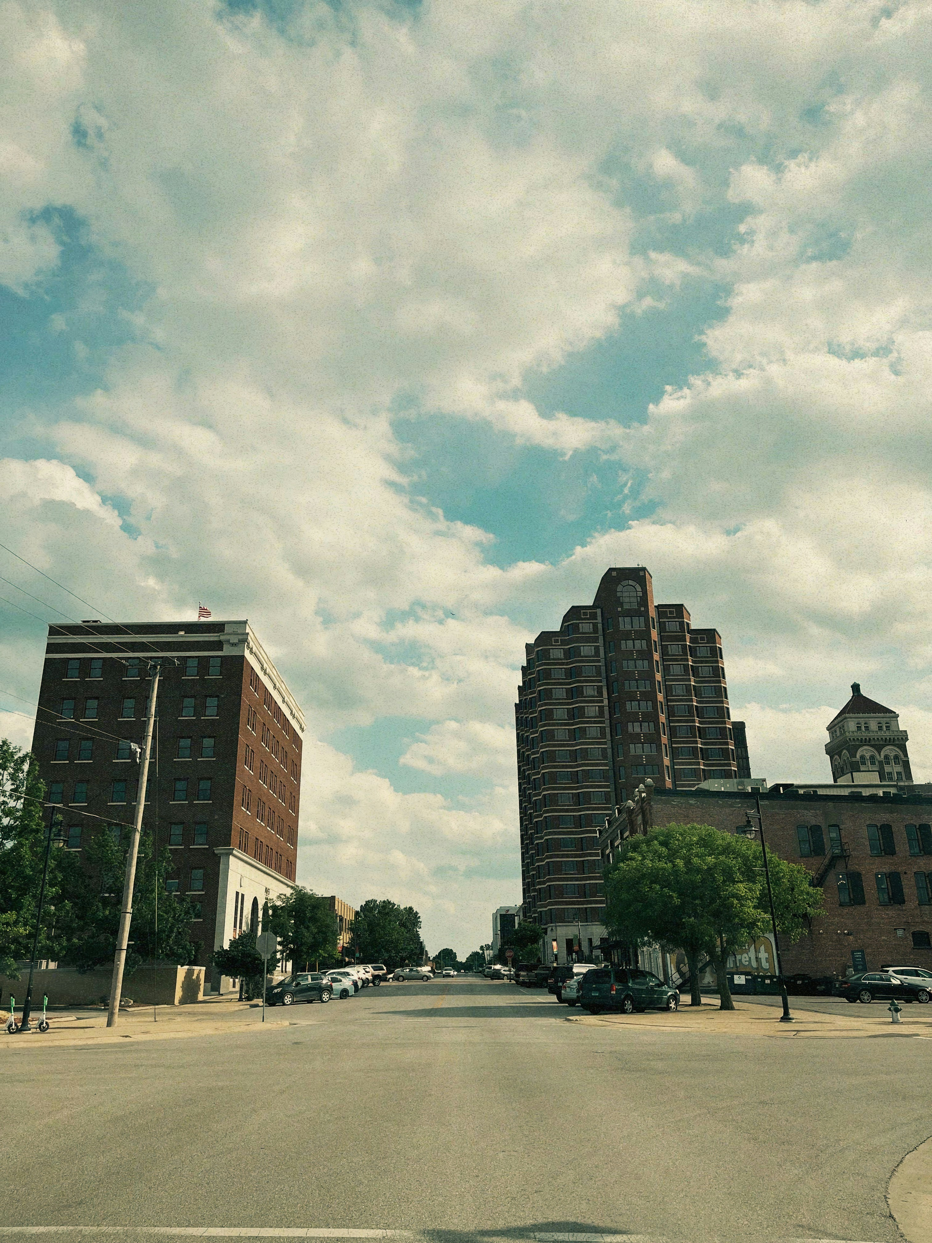 a city street with cars parked on the side of it