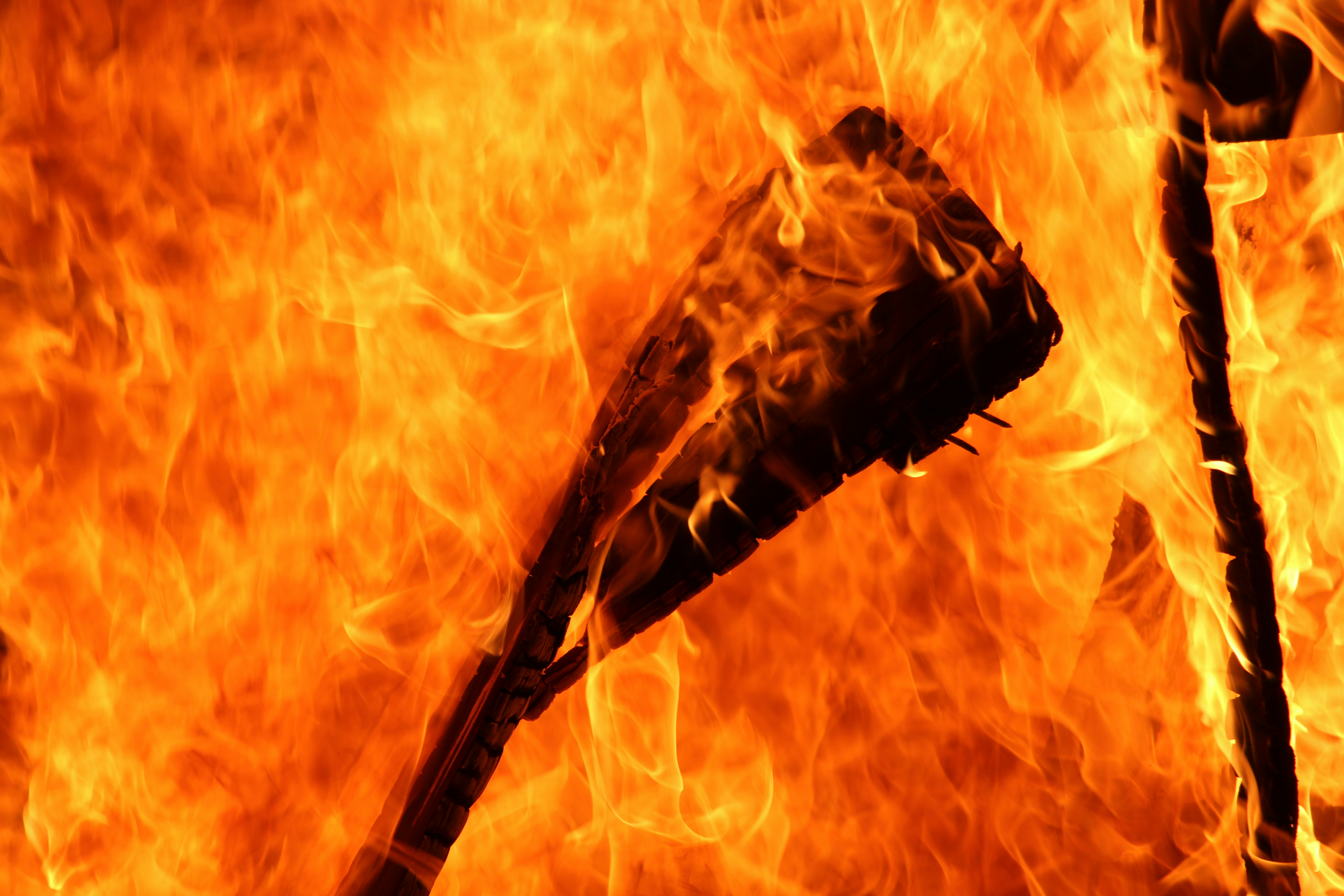 a close up of a guitar on fire