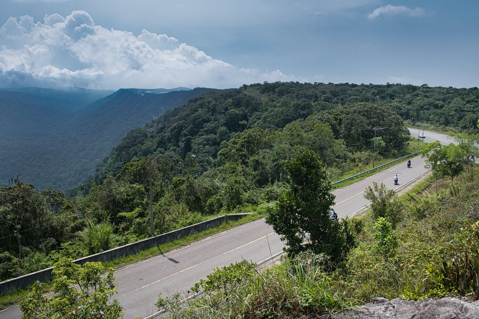 A rider on an open mountain road