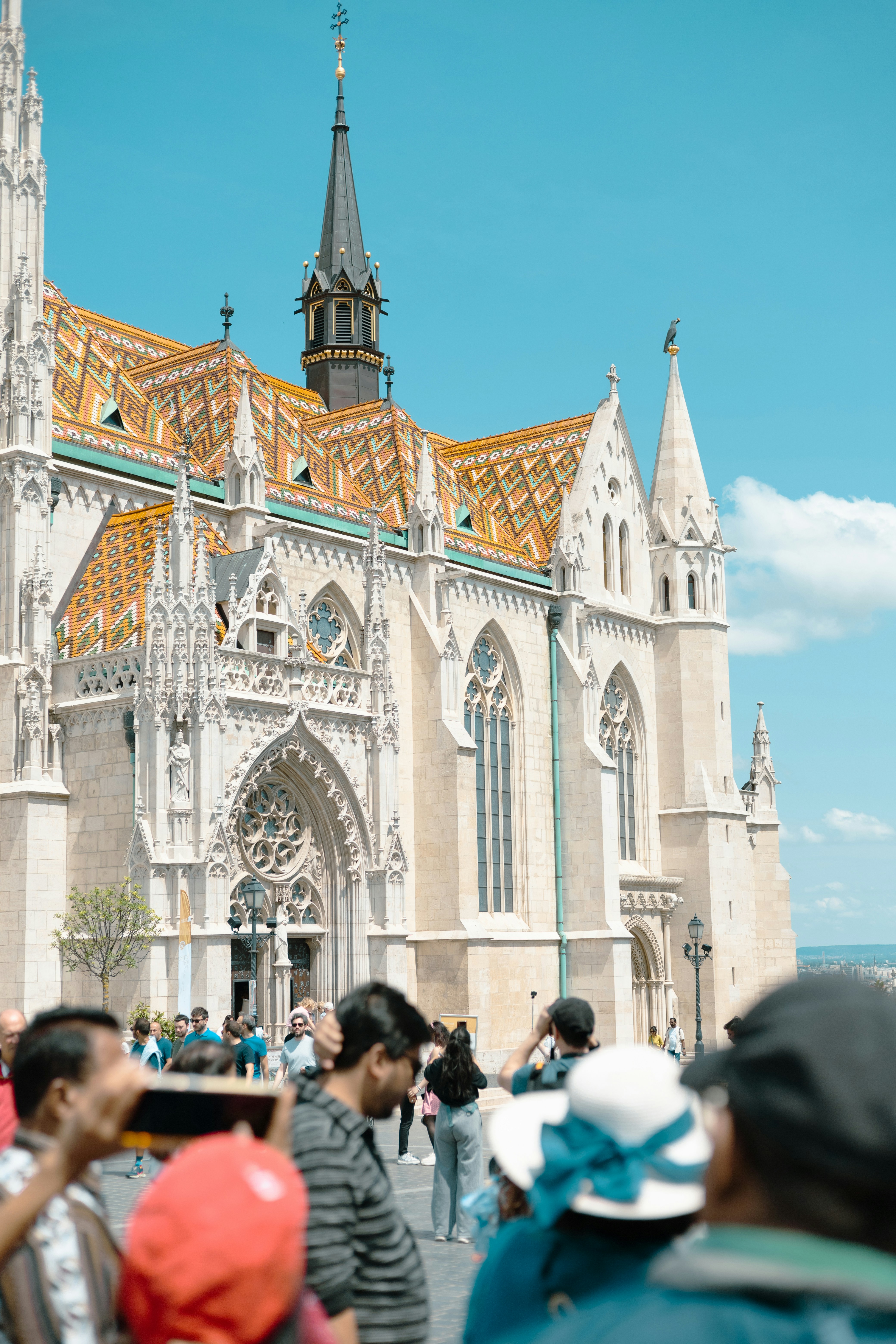 a group of people standing in front of a cathedral