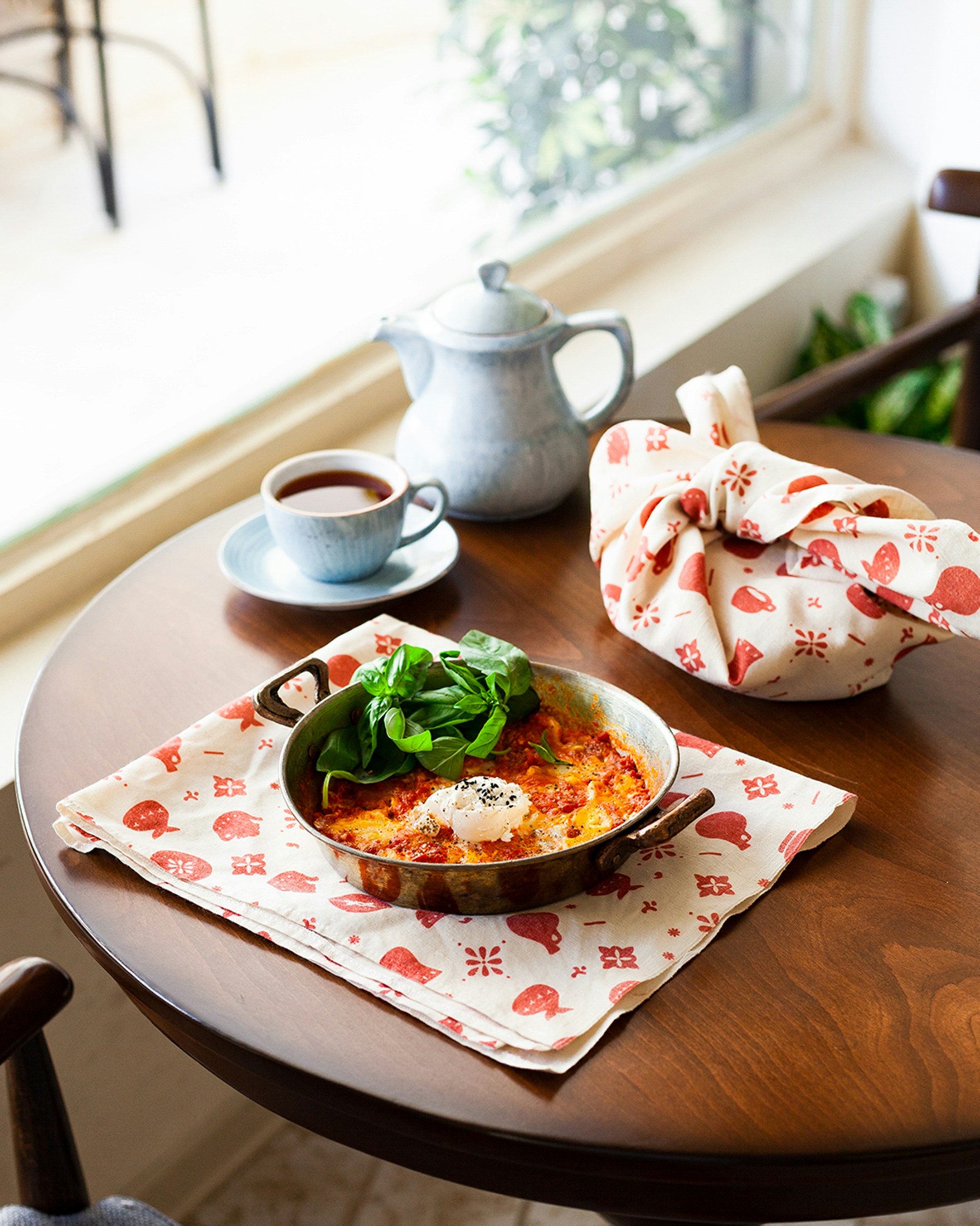 a wooden table with a plate of food on it