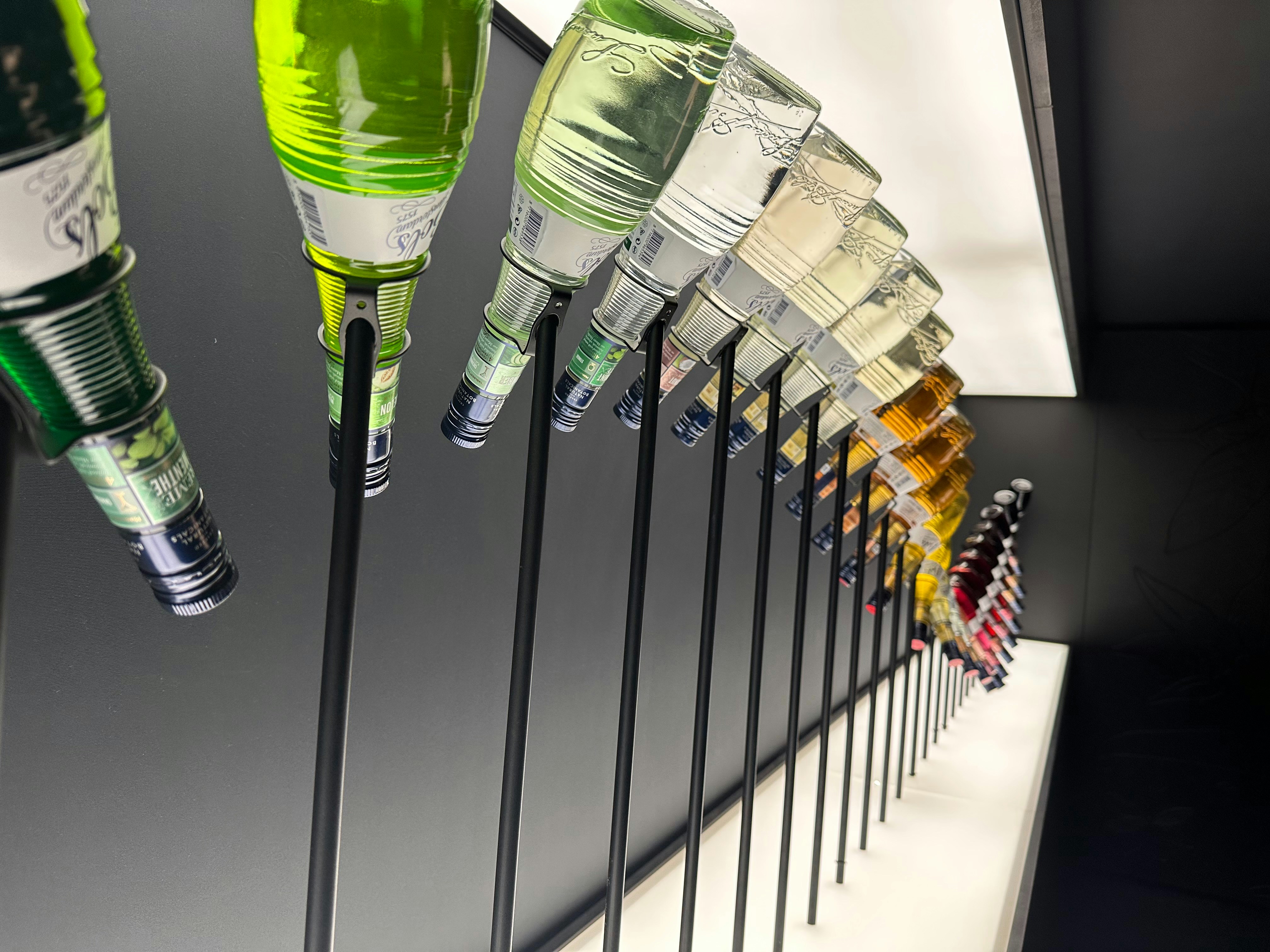 Group of matching product bottles lined up for a catalog collection shot