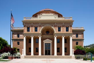 a large building with a flag on top of it