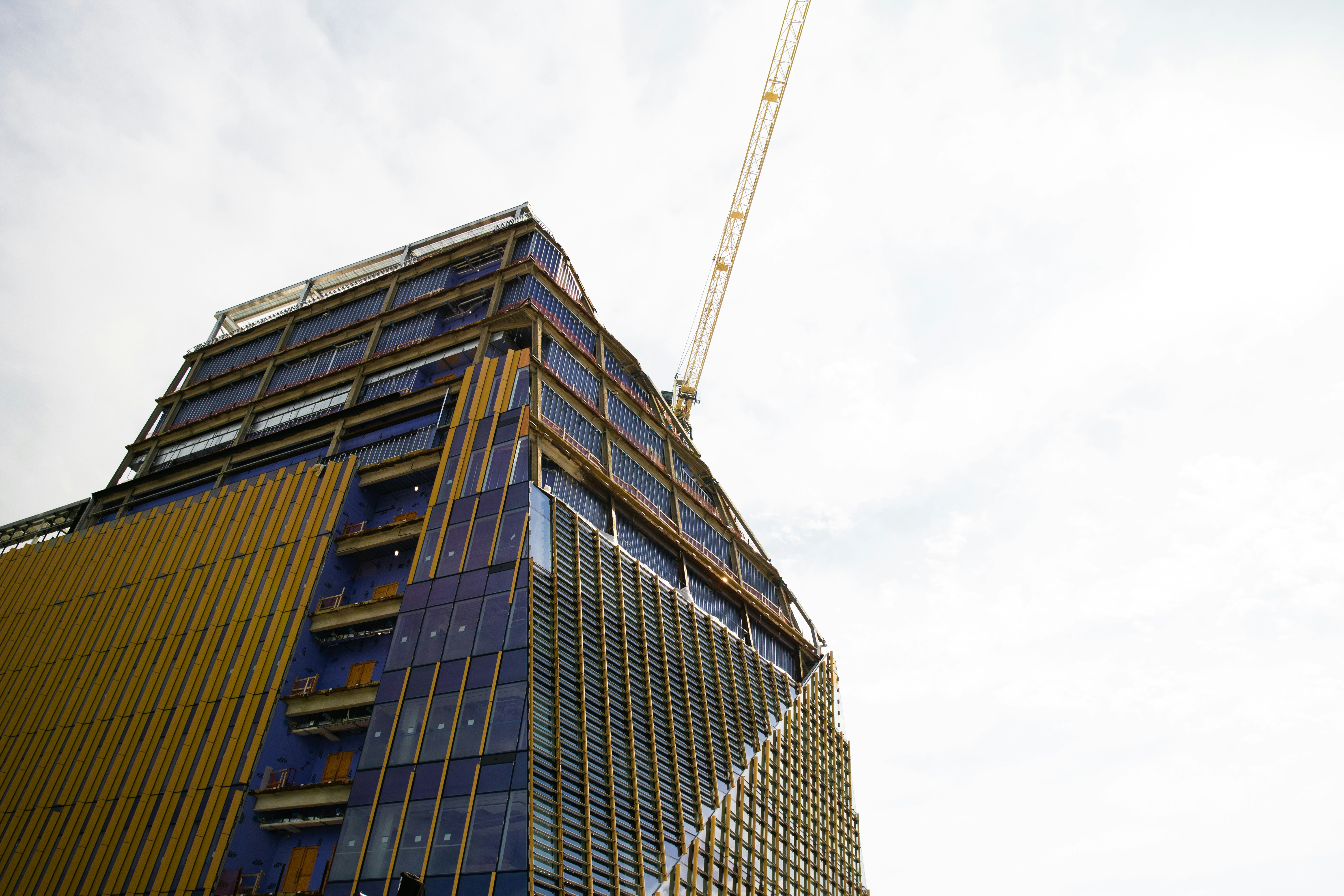 a tall building with a crane on top of it