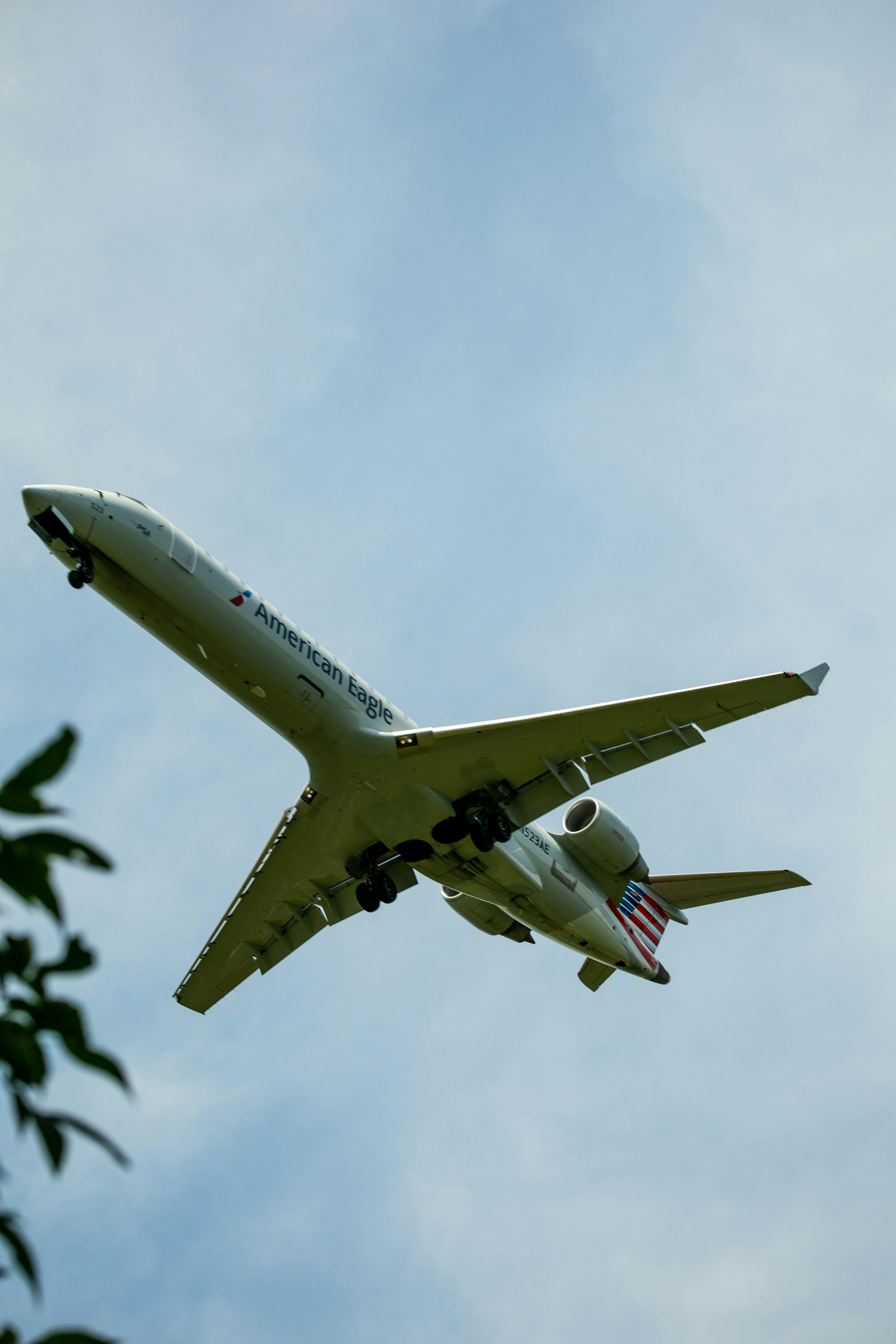 a large jetliner flying through a blue sky