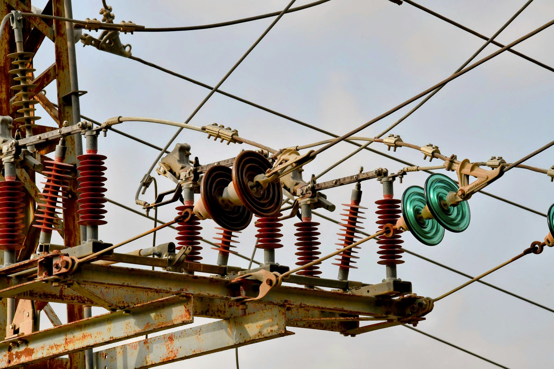 a bunch of wires that are hanging from a pole