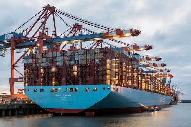 a large blue and red ship in the water