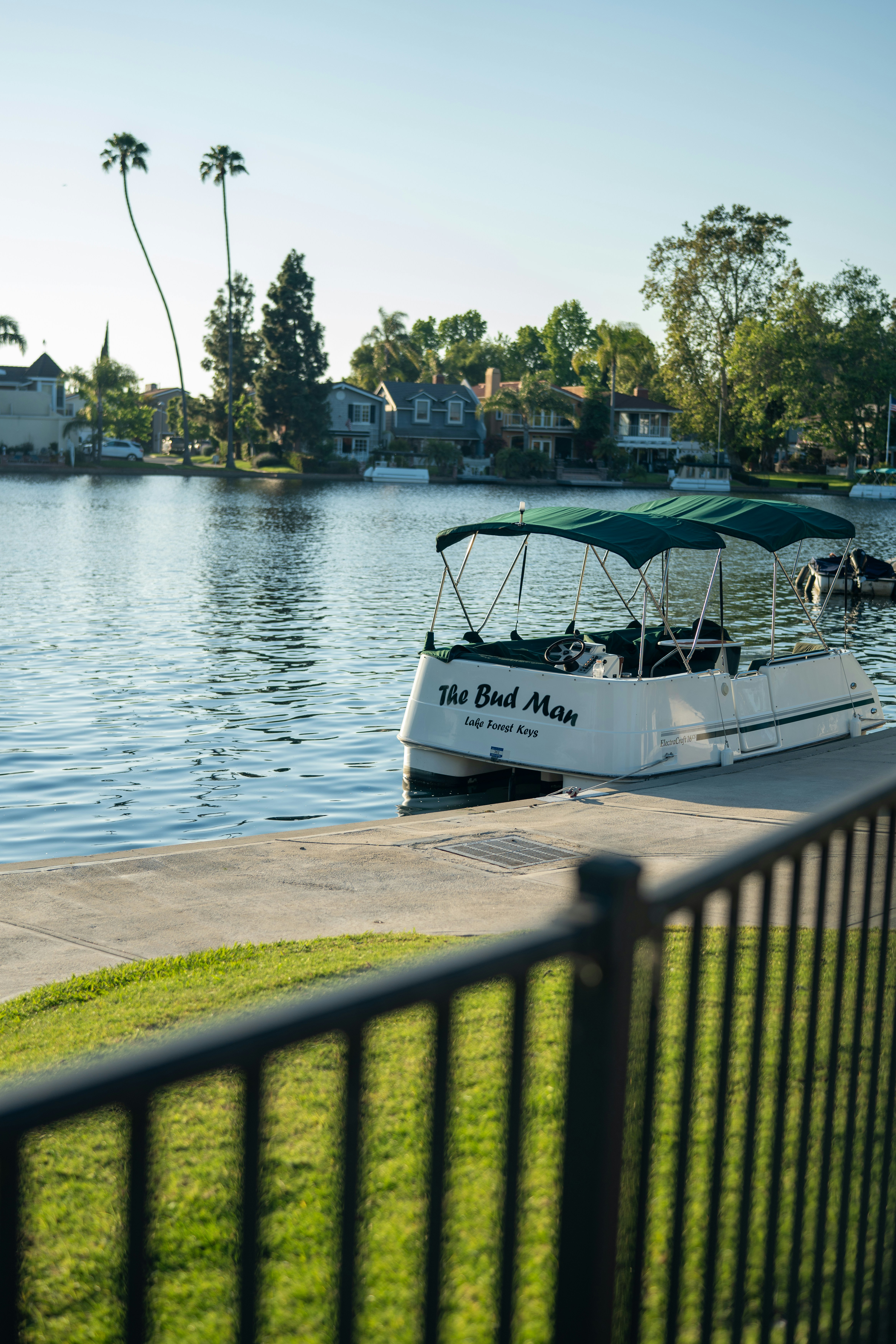 a boat is docked at the edge of a lake