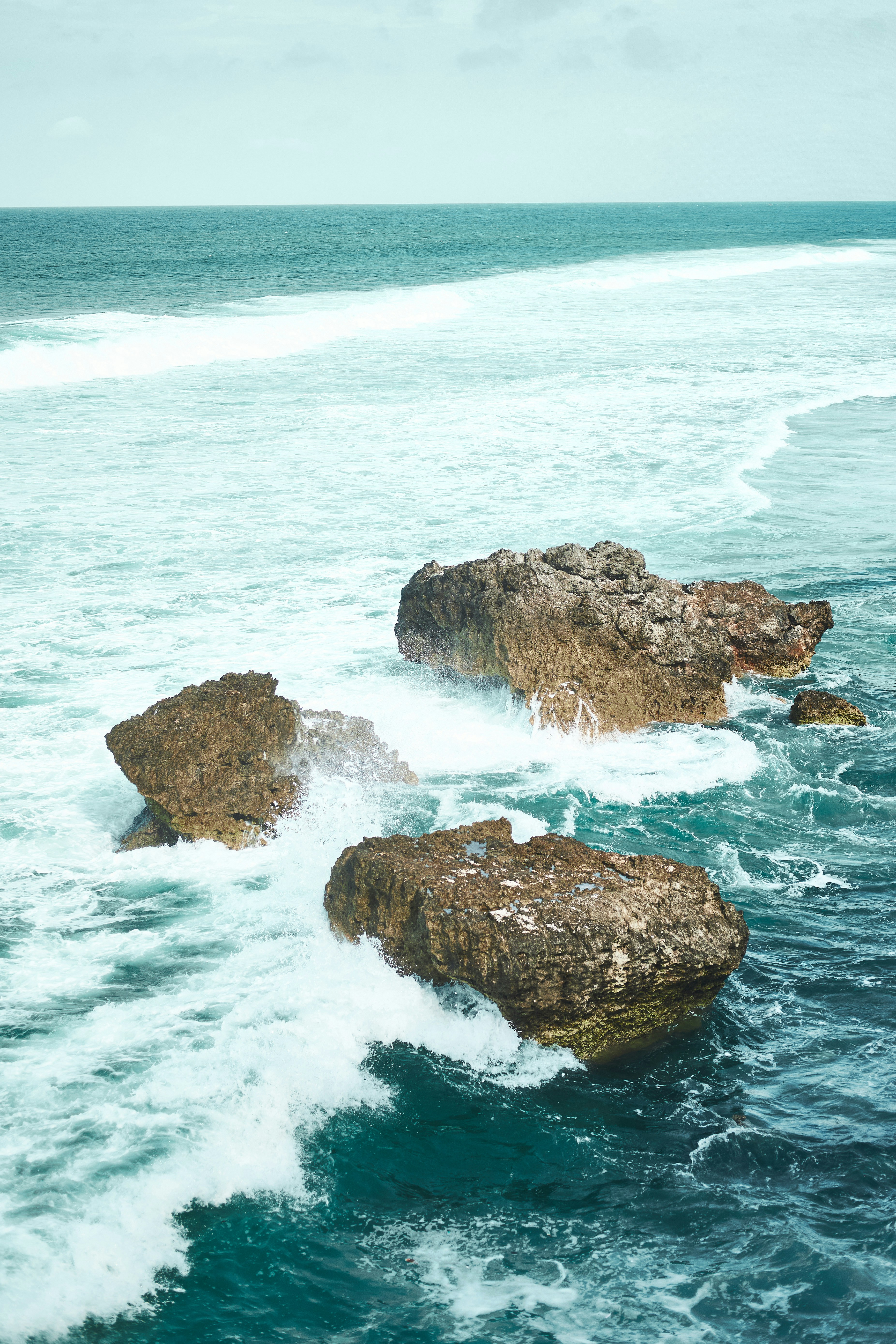 a couple of rocks that are in the water
