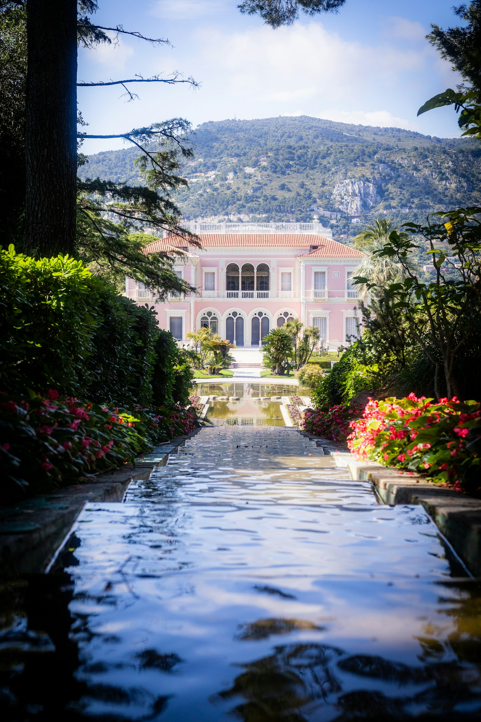 a large house with a pool in the middle of it
