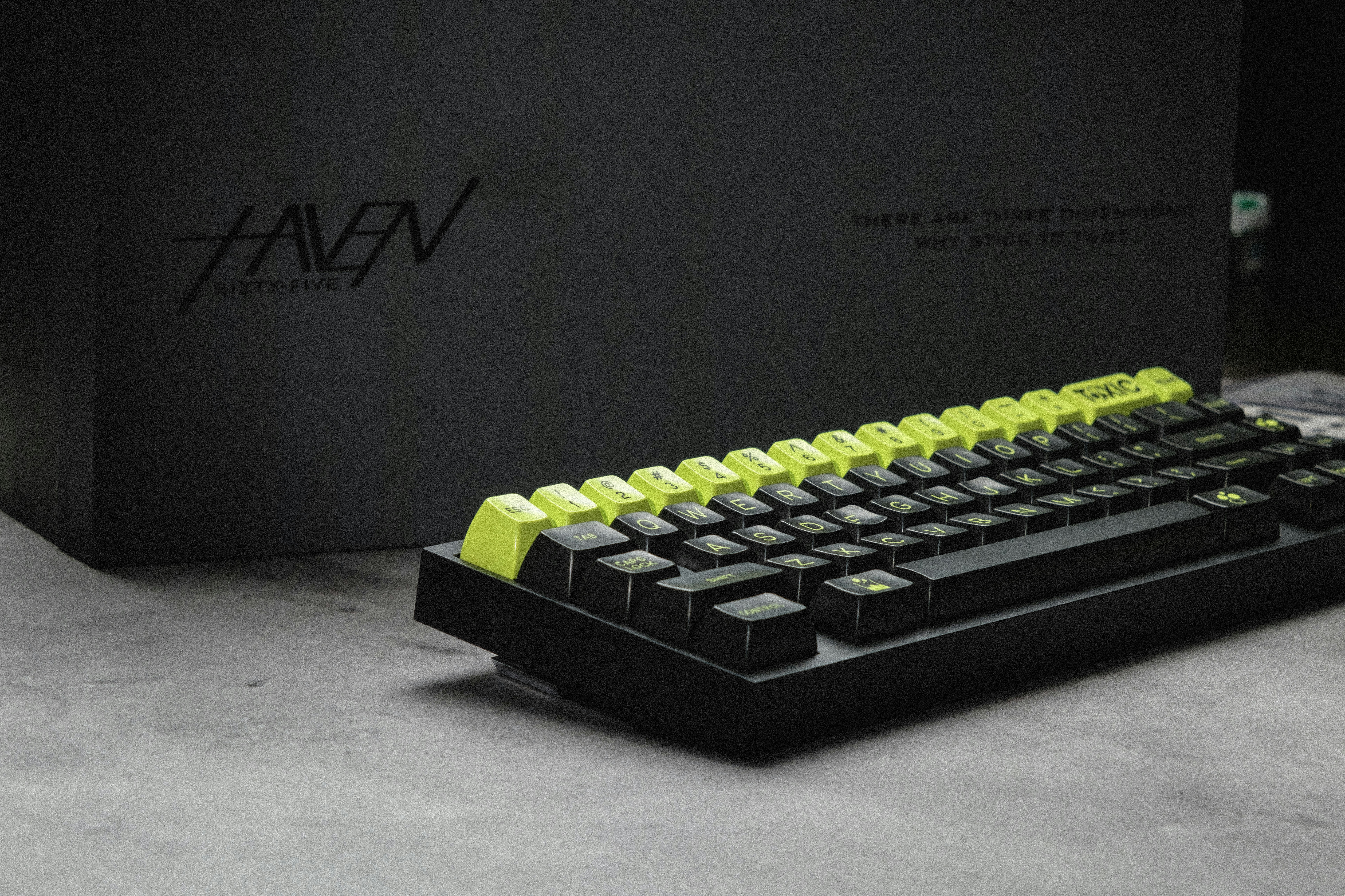 a black and yellow keyboard sitting on top of a table