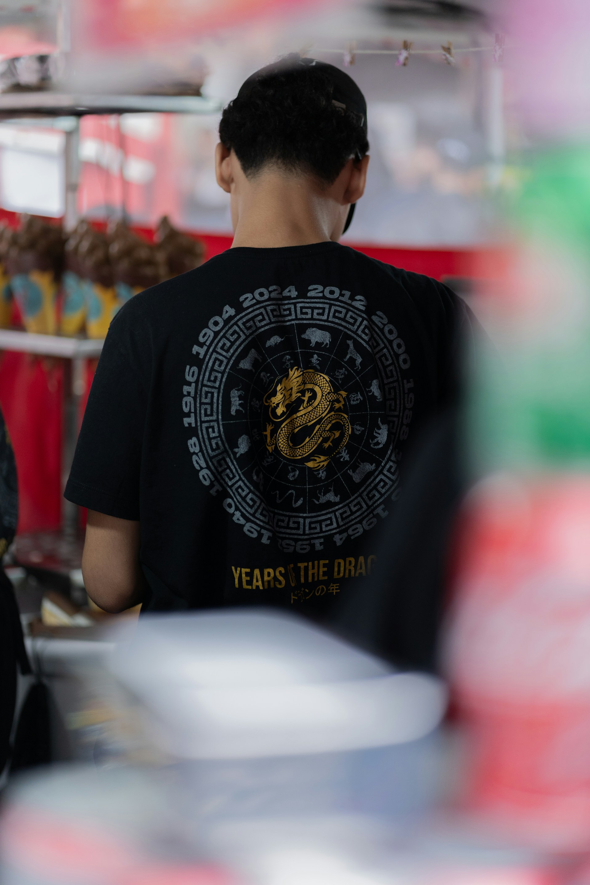 A man standing in front of a food cart