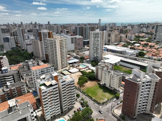 an aerial view of a city with tall buildings