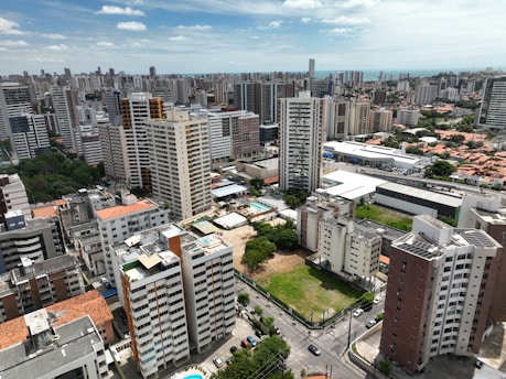 an aerial view of a city with tall buildings