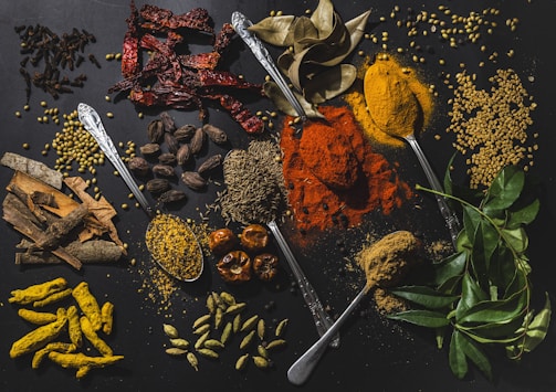 a table topped with different types of spices