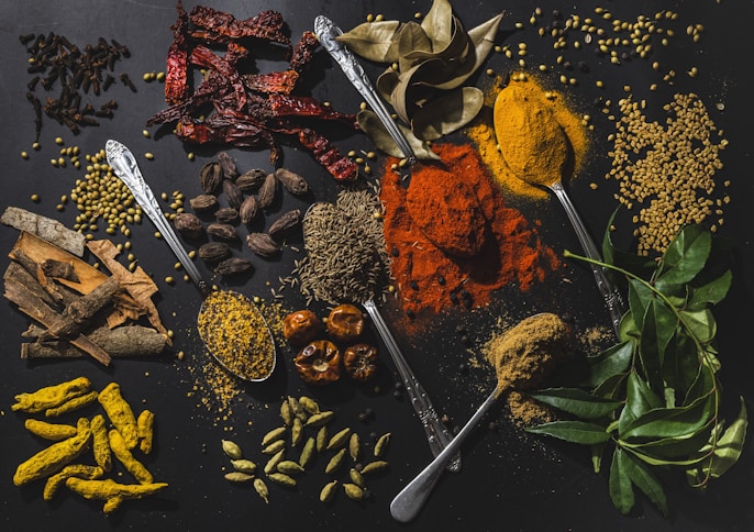 a table topped with different types of spices