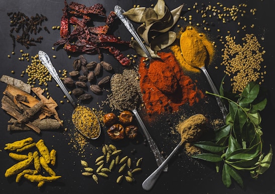 a table topped with different types of spices