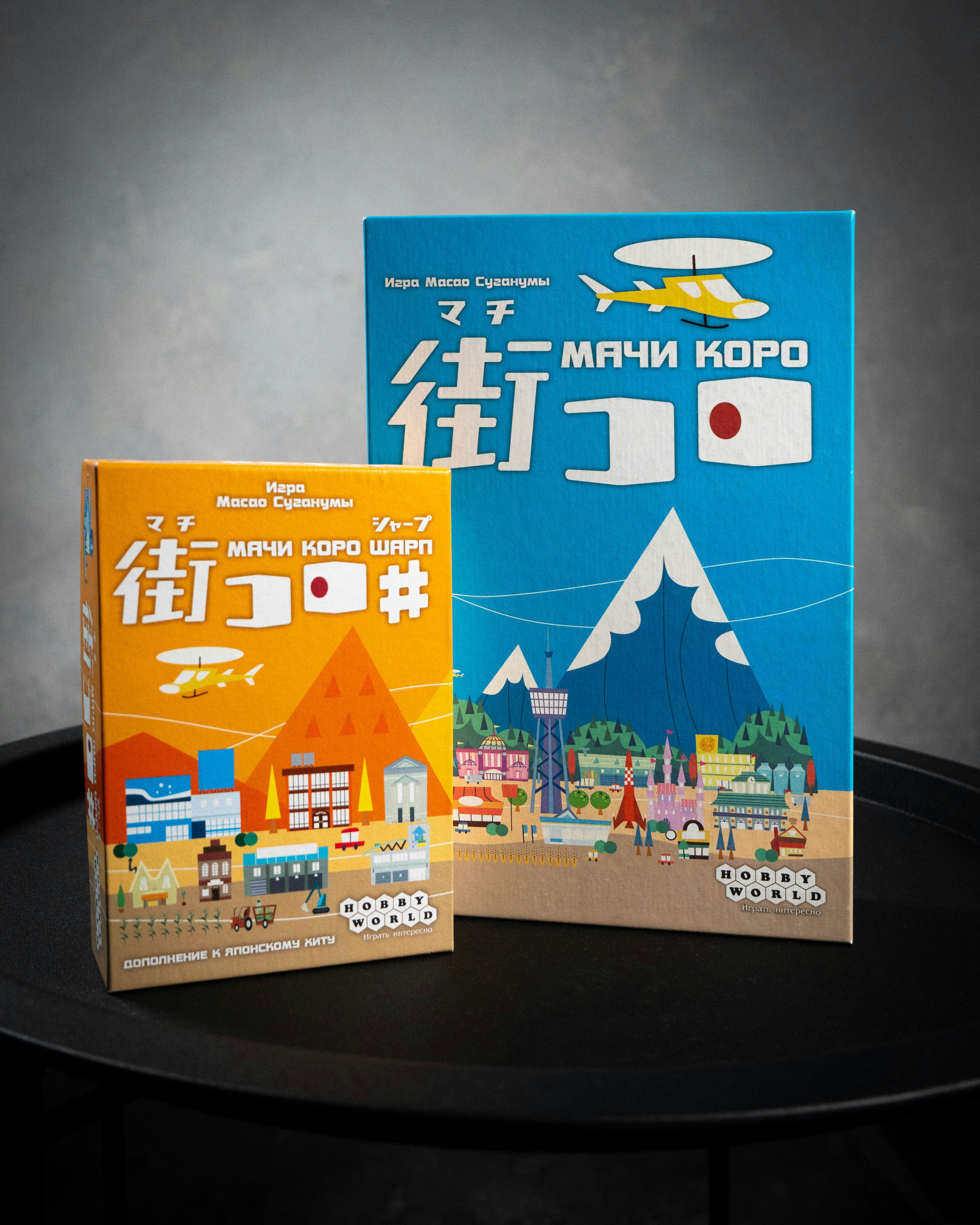 two books sitting on top of a black table