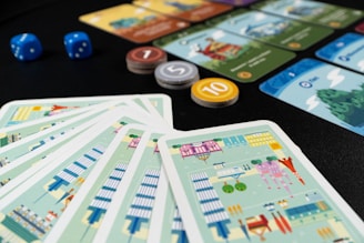 a close up of a number of cards and dice