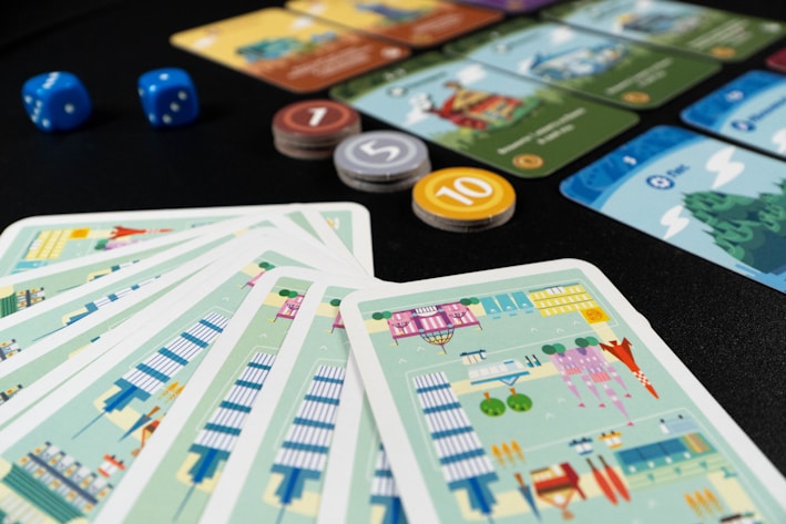 a close up of a number of cards and dice