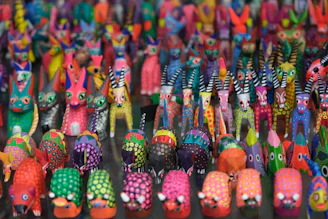 a large group of brightly colored toy animals