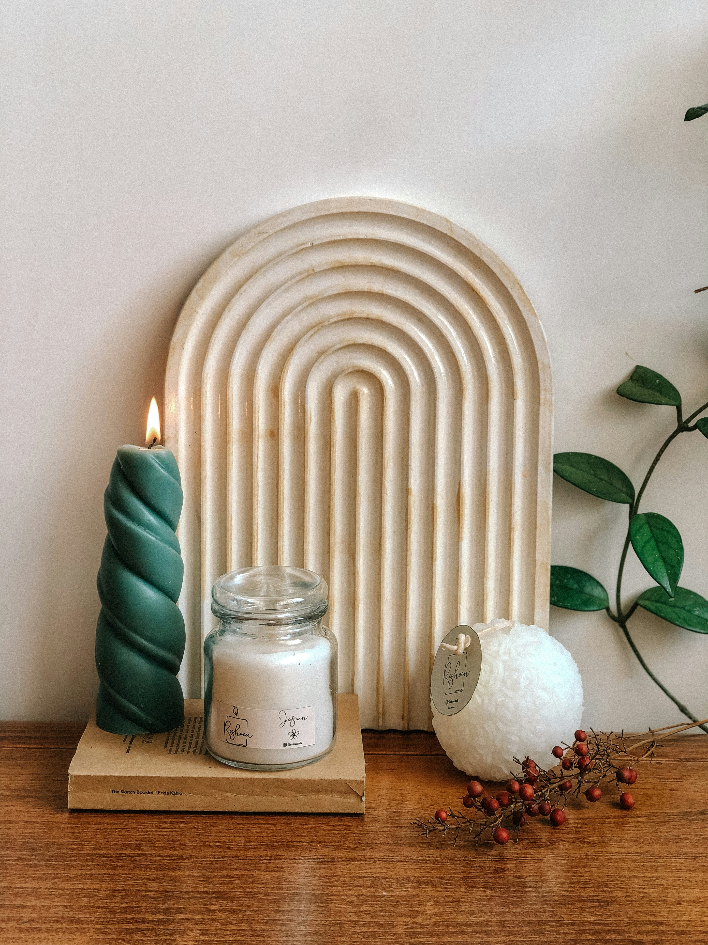 a candle and a candle holder on a table