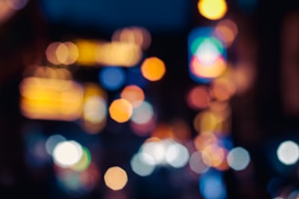 a blurry photo of a city street at night