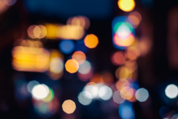a blurry photo of a city street at night
